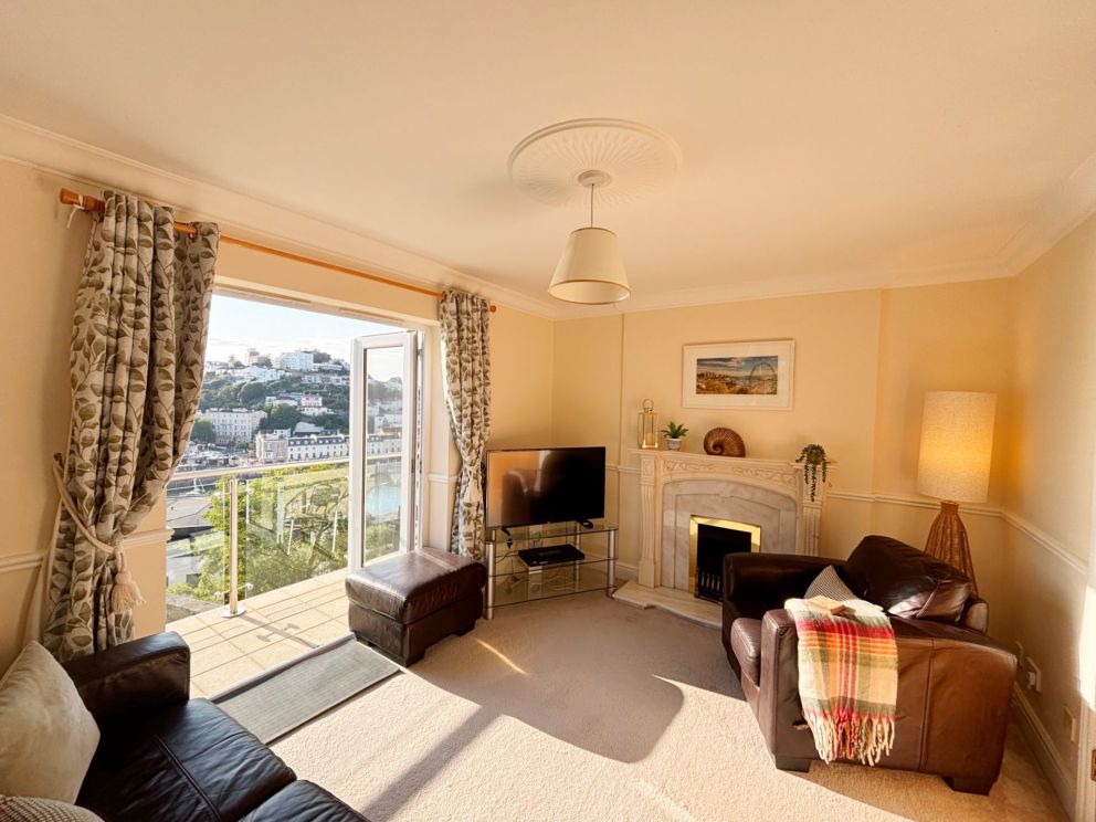 2, The Riviera, Torquay. First floor sitting room with balcony and views over the marina, harbour and seafront.