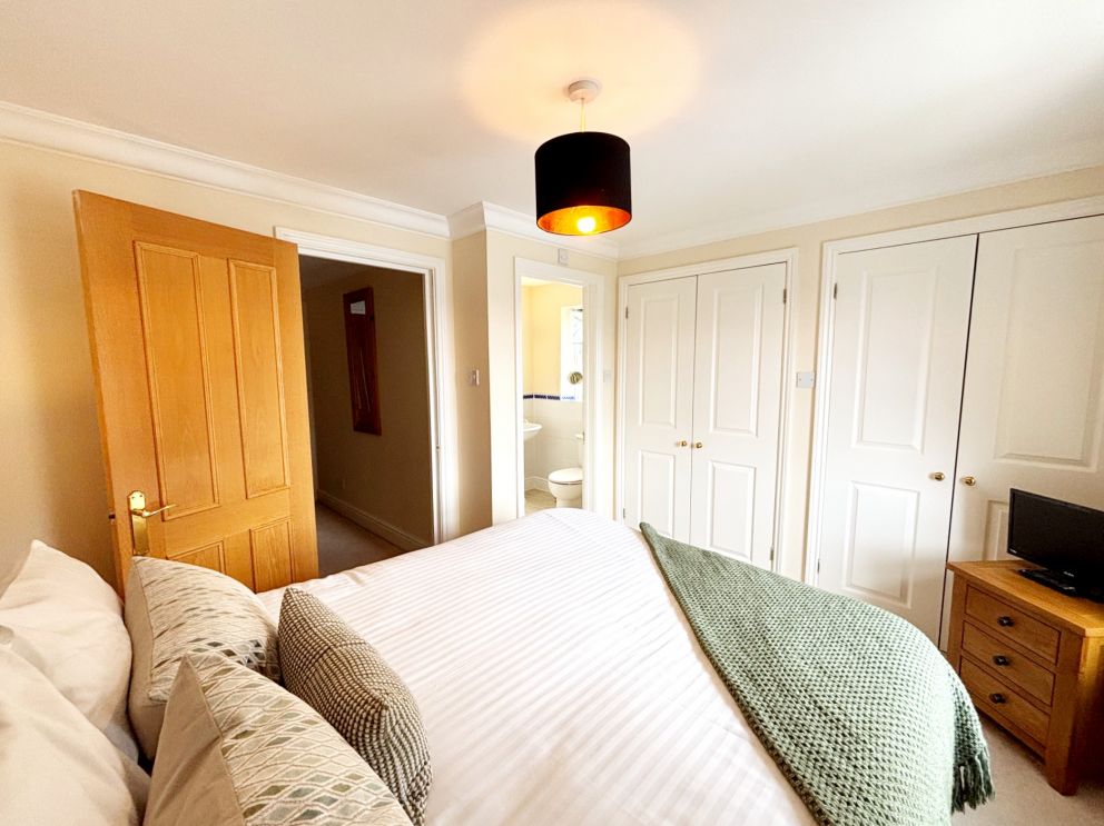 2, The Riviera, Torquay. Main bedroom with king sized bed and ensuite  shower room.