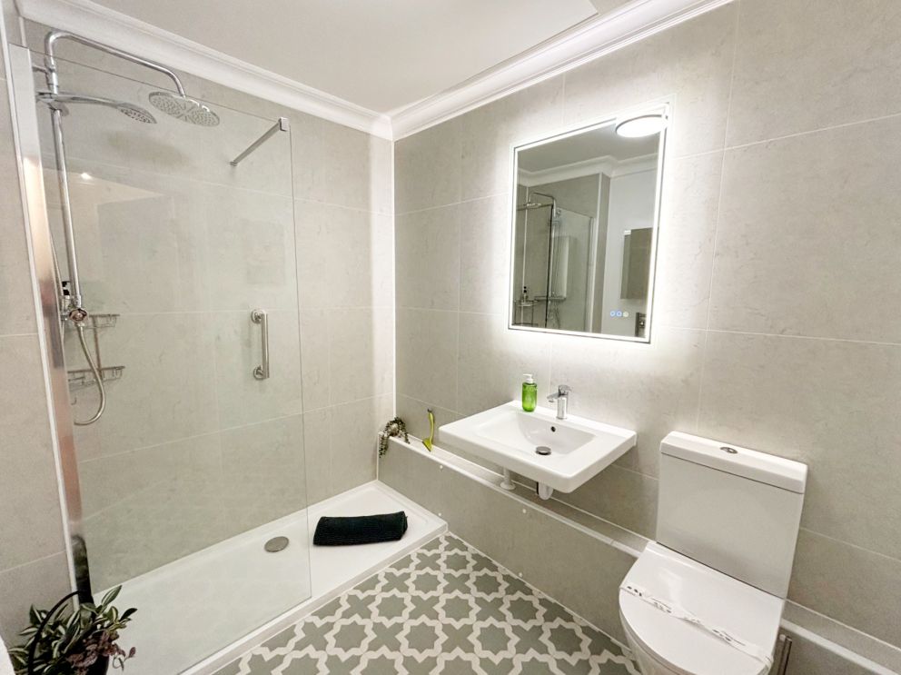 Forbes Ground Floor Suite at The Corbyn Apartments on The English Riviera. Newly refitted bathroom with easier access shower and raised toilet.