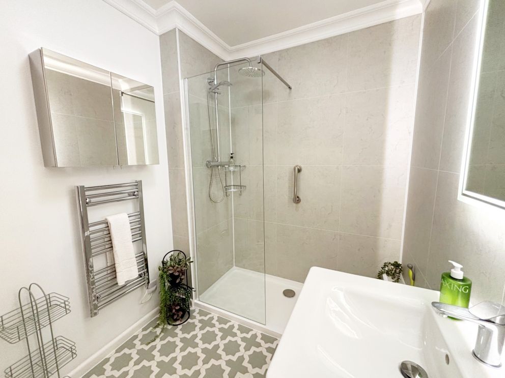 Forbes Ground Floor Suite at The Corbyn Apartments in Torquay. Bathroom with easier access shower and grab rail,