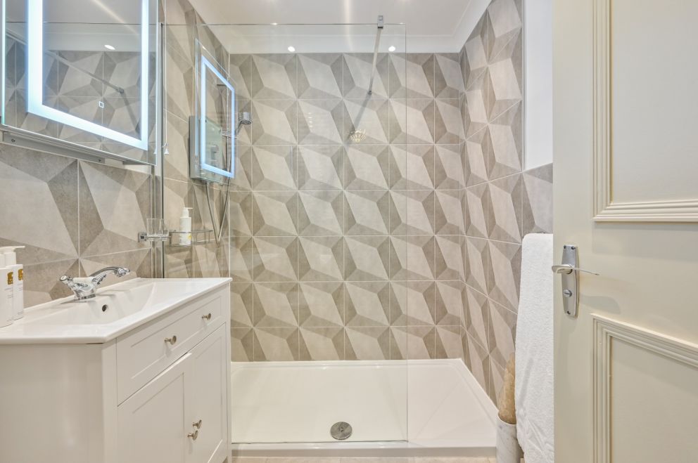 Apartment 3, The Muntham Luxury Holiday Apartments in Torquay. Apartment has modern bathroom with easy access shower.