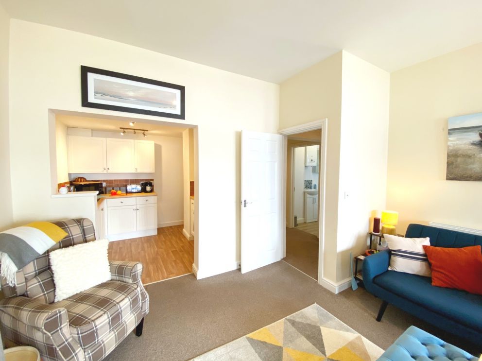 Open plan living space at No. 1 Marina Court - Sea View Apartment in Torquay