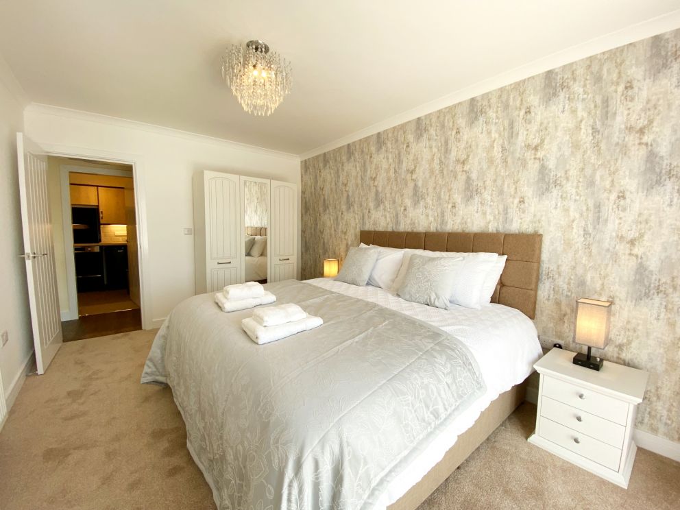 Ockendon House Apartment B - Bedroom with plenty of storage space.
