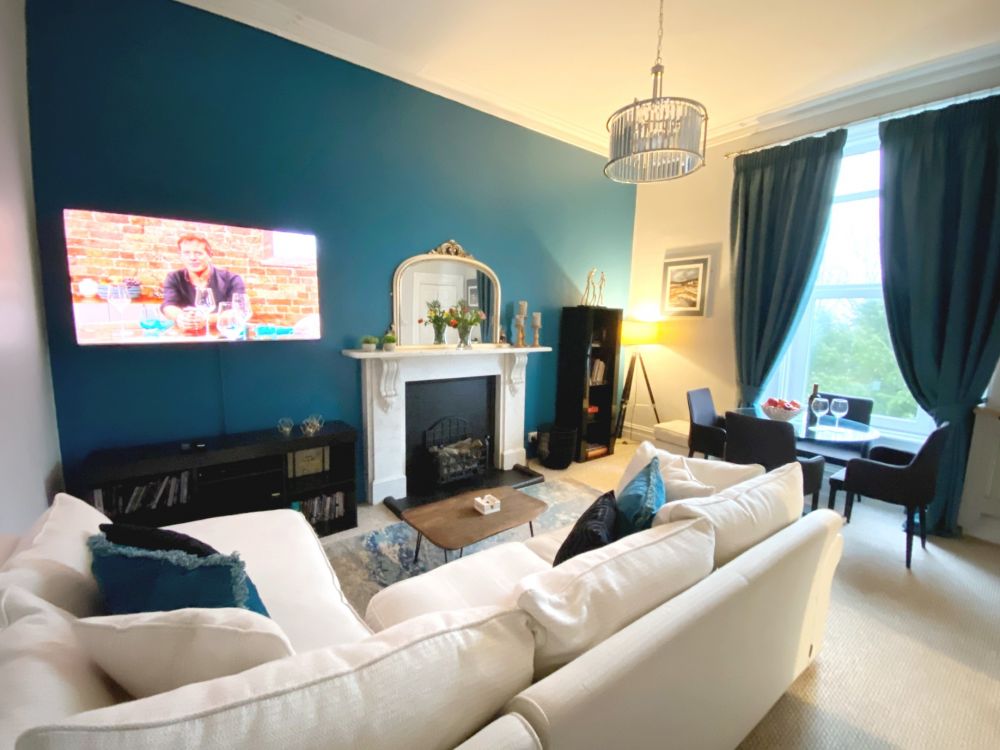 Redcliffe Apartment A, Torquay - Living room with dining area.