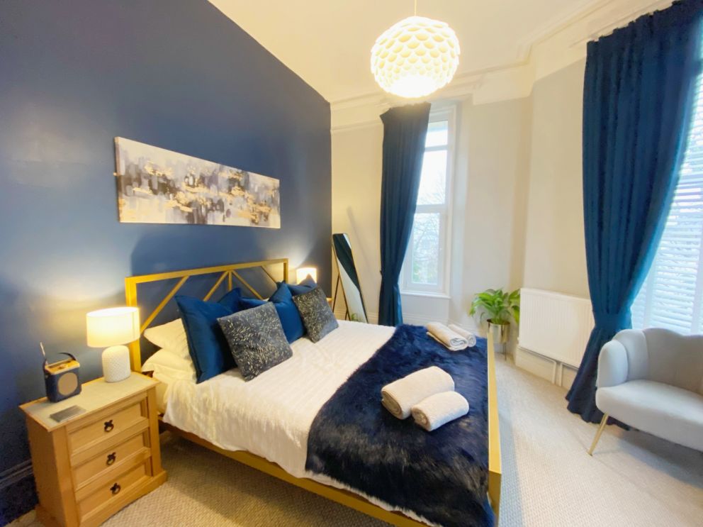 Redcliffe Apartment A, Torquay - Main bedroom with large windows.