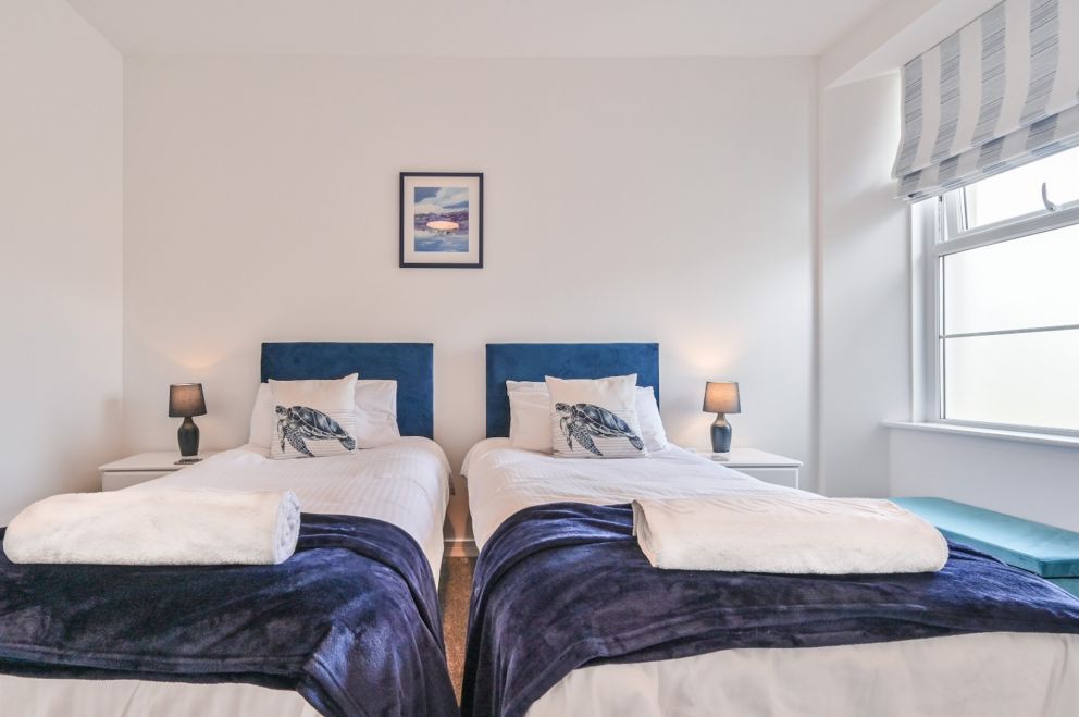 The Falstone Holiday Apartment - second bedroom set as two singles.