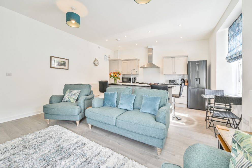 The Falstone Apartment in Torquay - seating area in open plan living space.