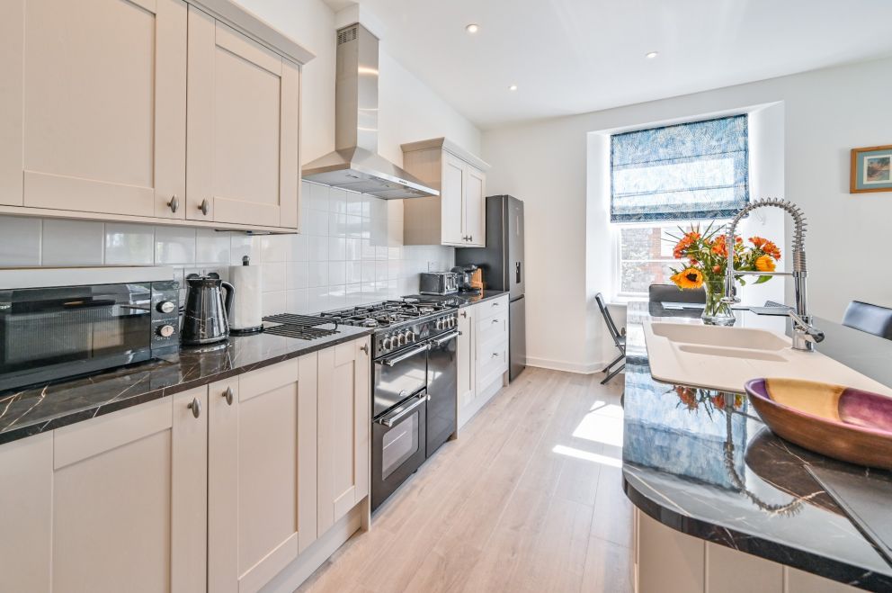 The Falstone Self Catering Holiday Apartment in St Marychurch ara of Torquay - well equipped modern kitchen.